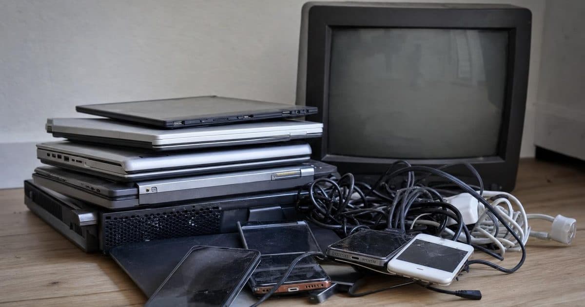Old electronic devices and cables sorted for recycling in Fareham